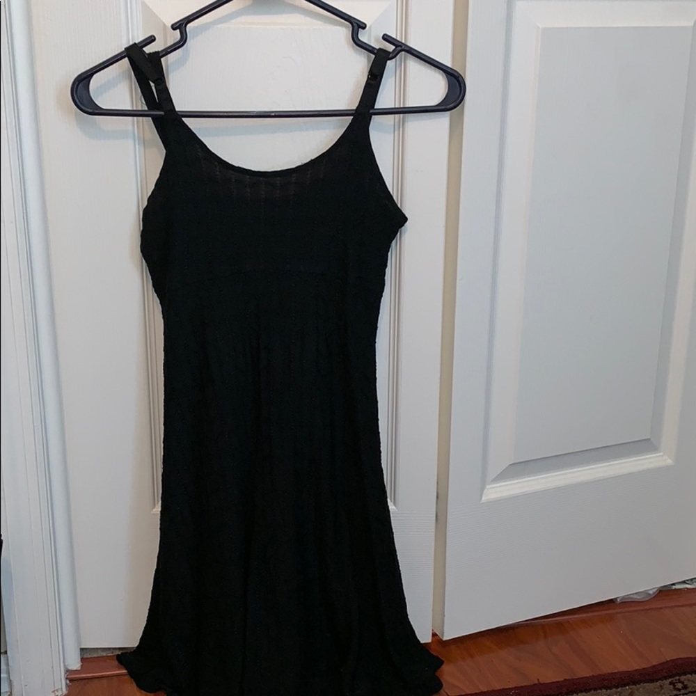 Short black fitted dress.
